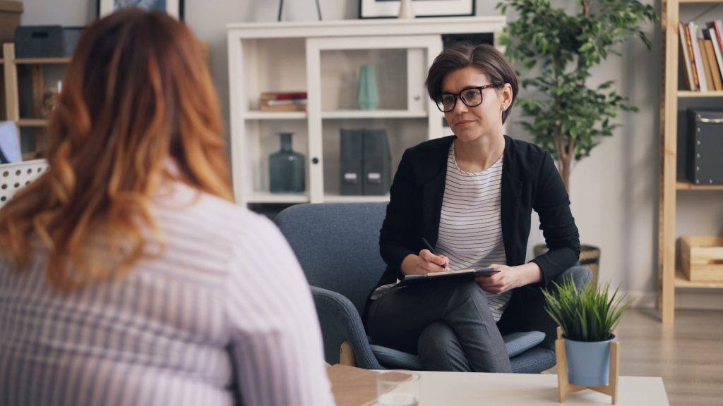 Two women in a calm, supportive coaching conversation